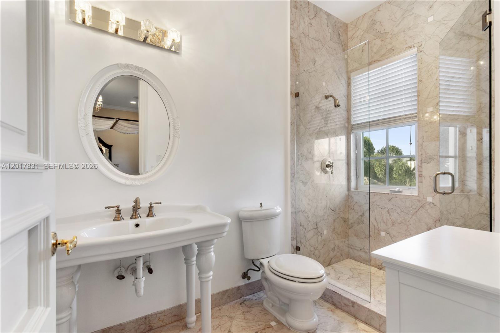 2951 Lake Ridge Lane Weston, FL 33332 - Photo 42 of 64 a bathroom with a sink a toilet and shower