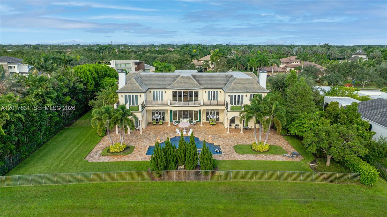 2951 Lake Ridge Lane Weston, FL 33332 - Photo 50 of 64 a view of a house with a big yard