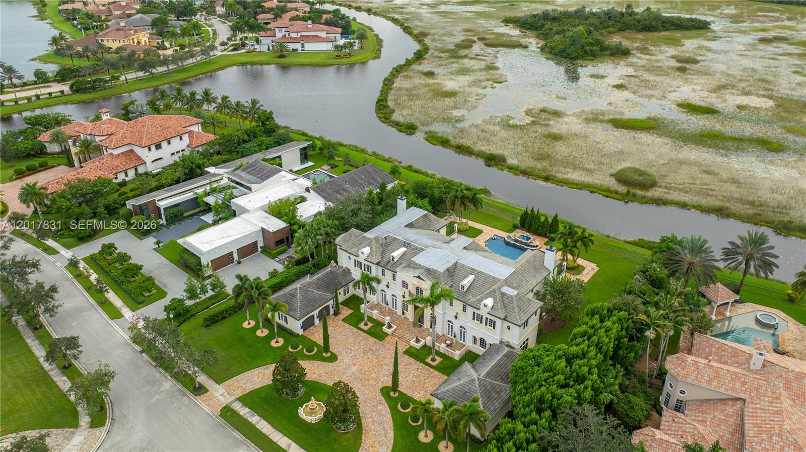 2951 Lake Ridge Lane Weston, FL 33332 - Photo 55 of 64 an aerial view of residential houses with outdoor space