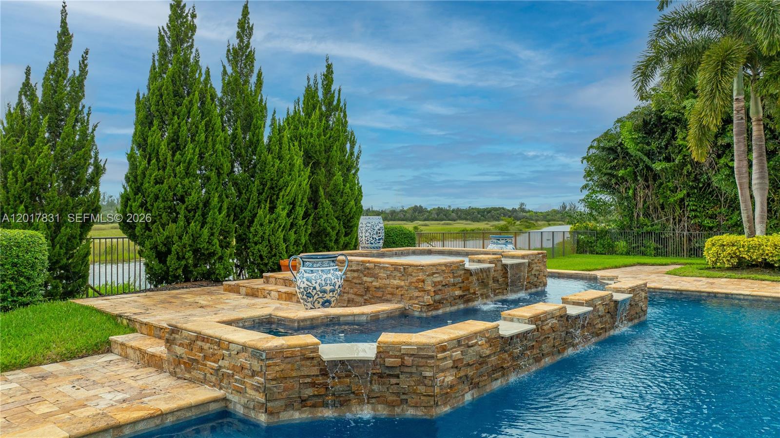 2951 Lake Ridge Lane Weston, FL 33332 - Photo 58 of 64 a view of a swimming pool with a patio