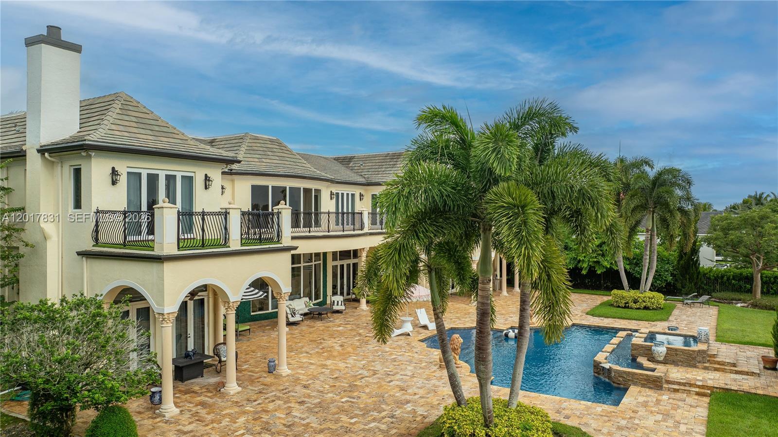 2951 Lake Ridge Lane Weston, FL 33332 - Photo 59 of 64 a front view of a house with garden and seating area