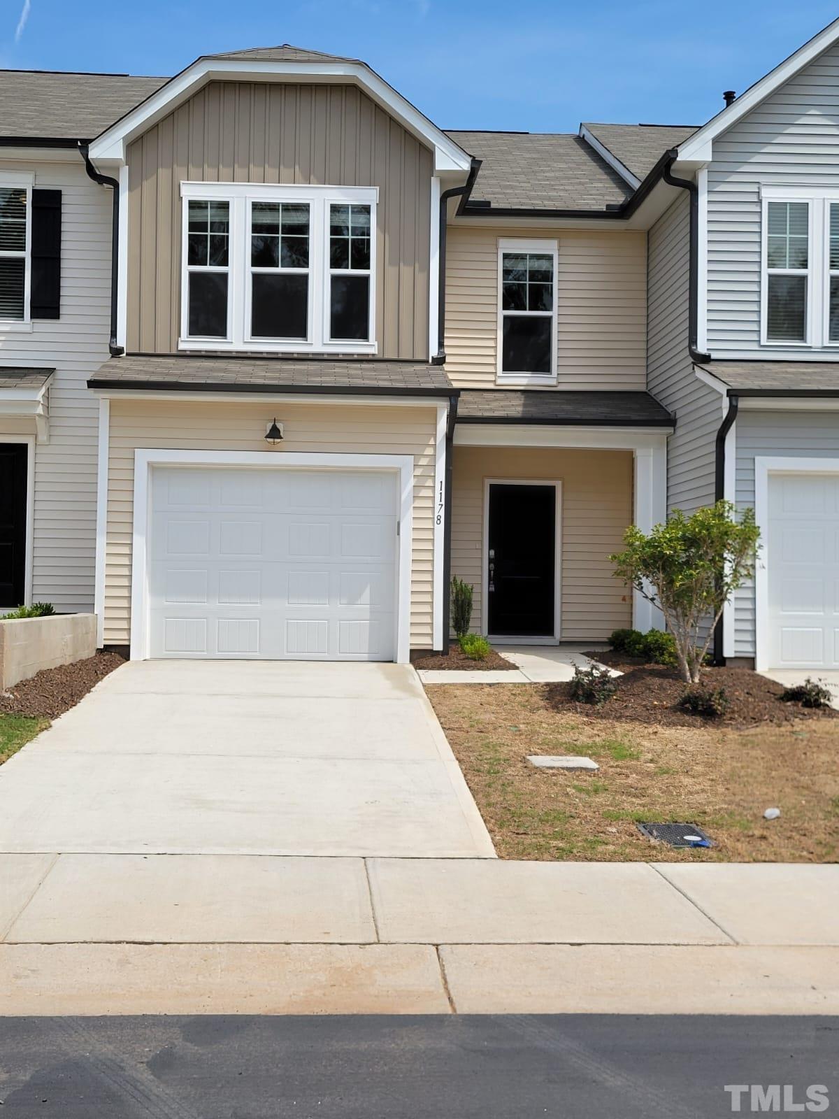 a front view of a house with yard