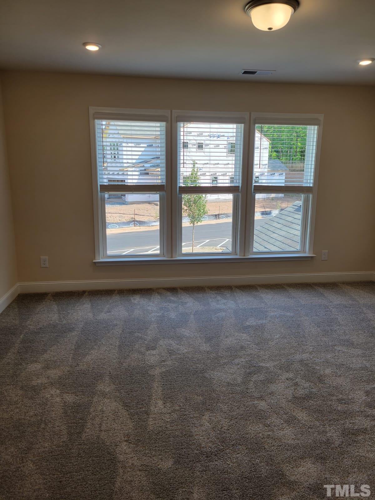 1178 Citadel Avenue Durham, NC 27713 - Photo 8 of 15 an empty room with windows and entrance