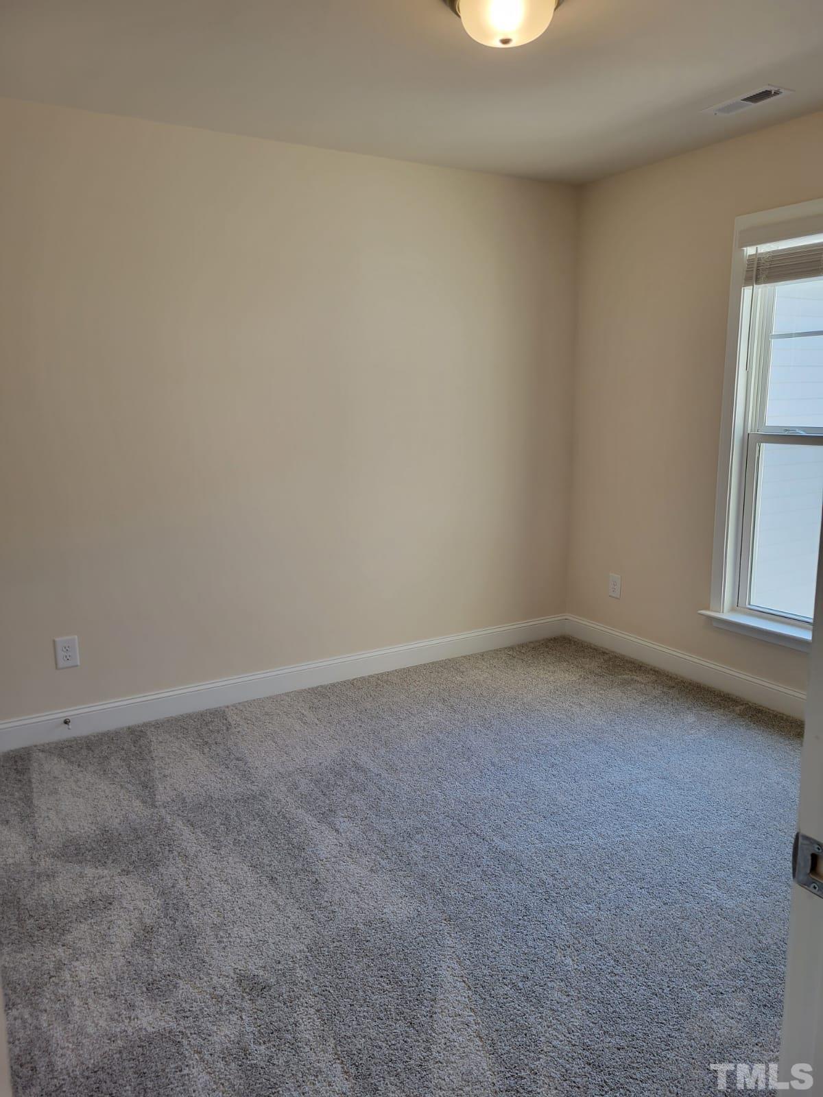 1178 Citadel Avenue Durham, NC 27713 - Photo 9 of 15 an empty room with windows and closet