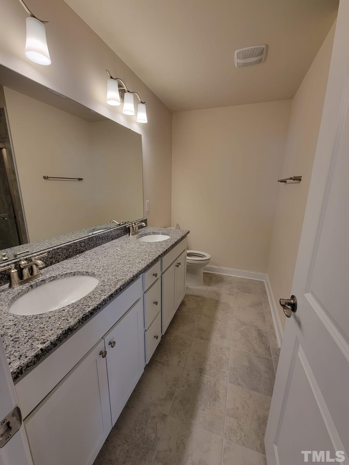 1178 Citadel Avenue Durham, NC 27713 - Photo 10 of 15 a bathroom with a sink and a mirror