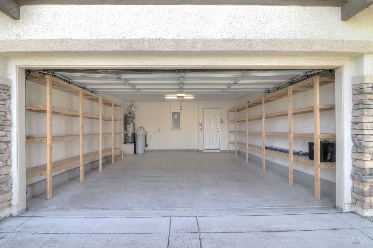 359 Glenn Lakes Drive Rio Vista, CA 94571 - Photo 28 of 34 two car garage with plenty of shelving
