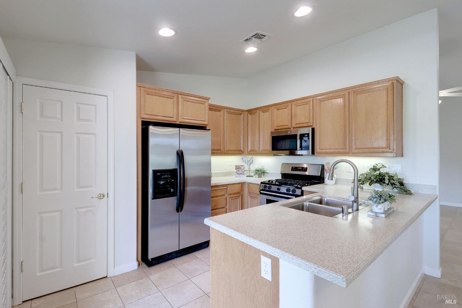 359 Glenn Lakes Drive Rio Vista, CA 94571 - Photo 8 of 34 kitchen with roomy pantry and stainless appliances