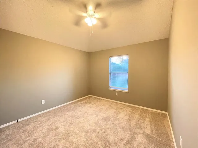 an empty room with a empty space and a window