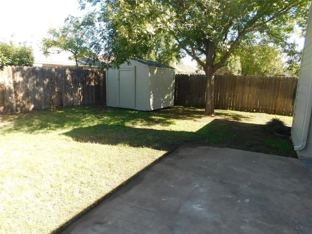 a backyard of a house with yard and trees