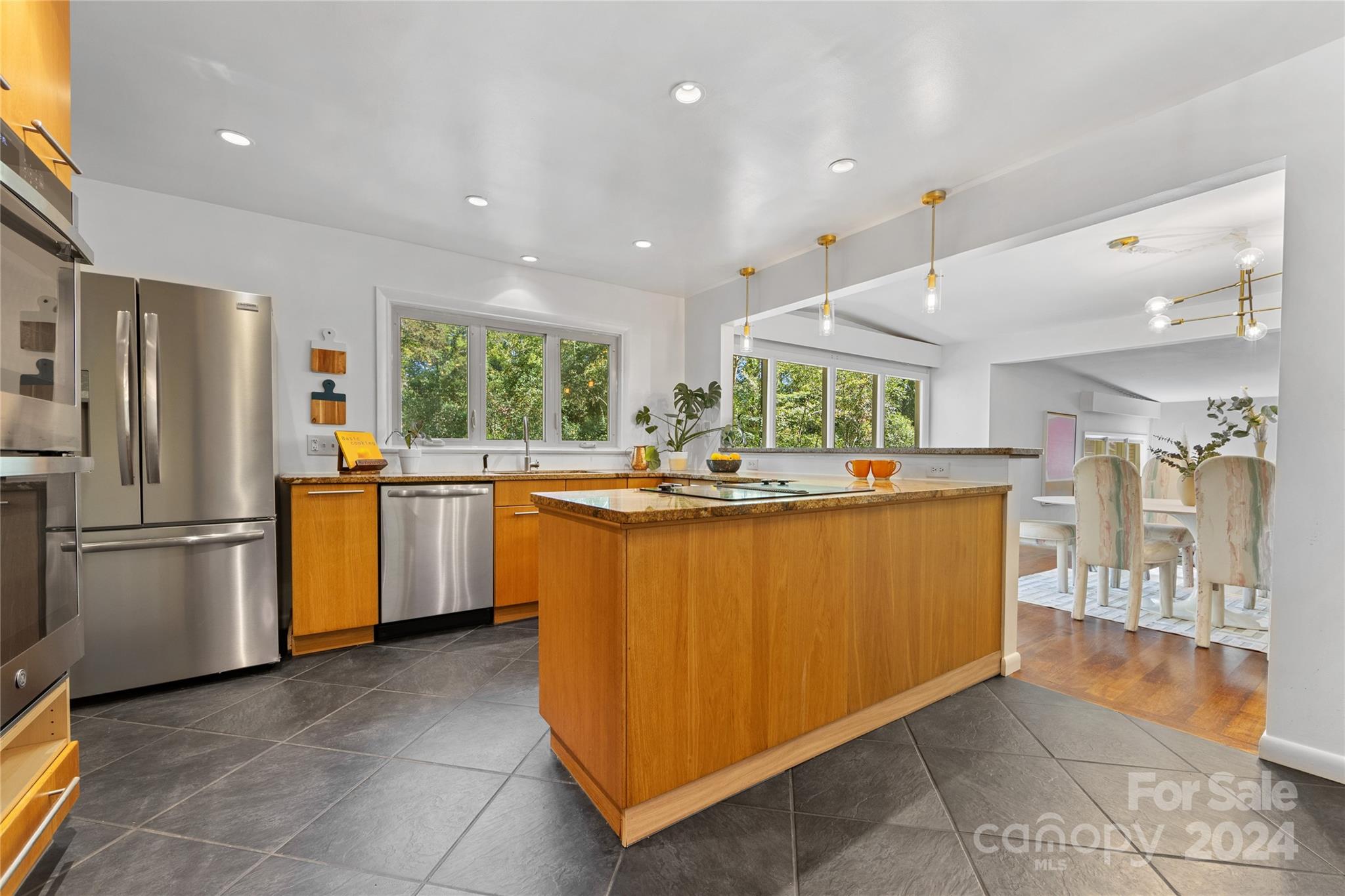 5601 Riviere Drive Charlotte, NC 28211 - Photo 13 of 38 a kitchen with stainless steel appliances granite countertop a refrigerator a sink dishwasher and a stove with wooden floor