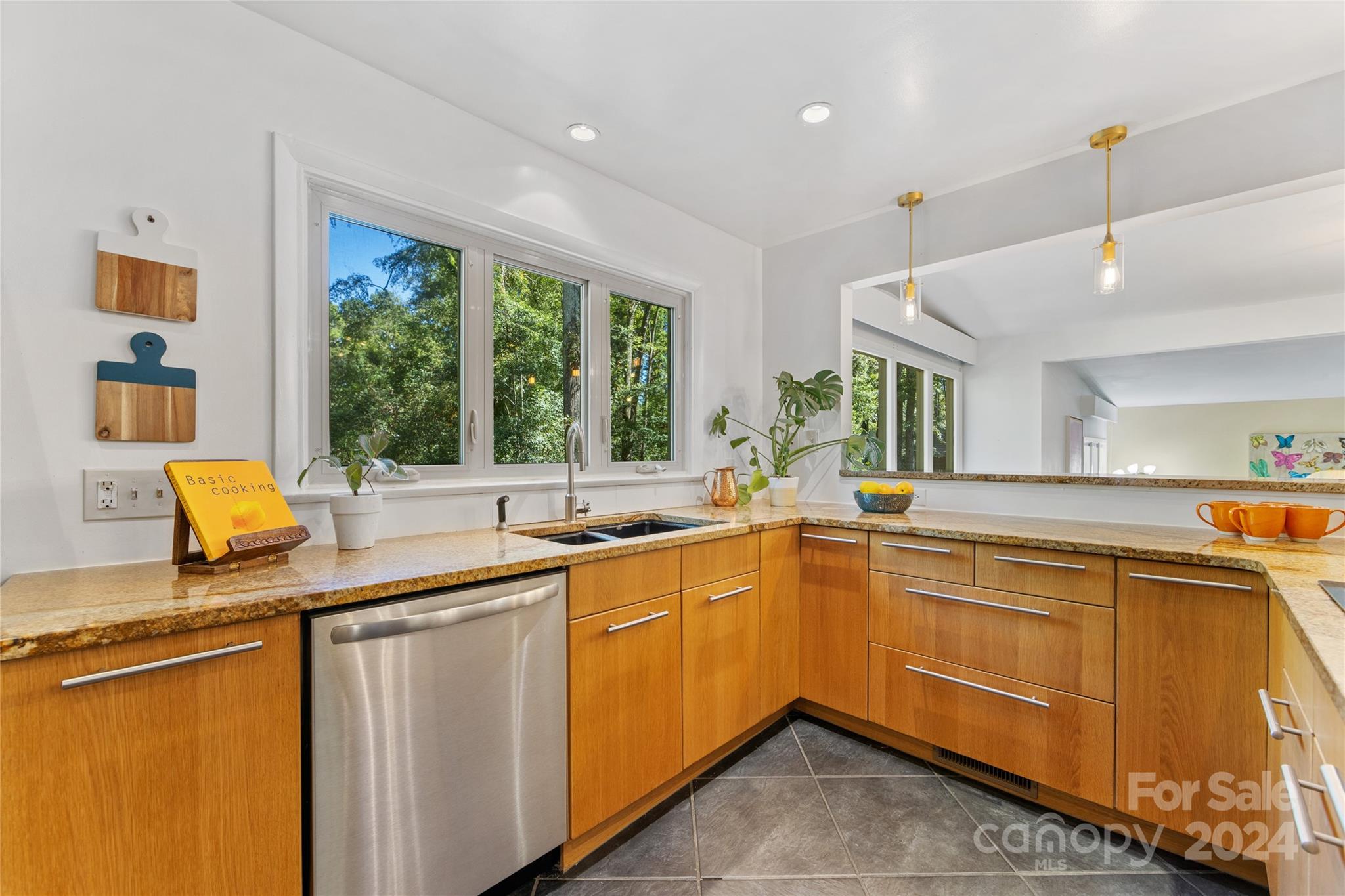 5601 Riviere Drive Charlotte, NC 28211 - Photo 14 of 38 a kitchen that has a sink and a stove in it