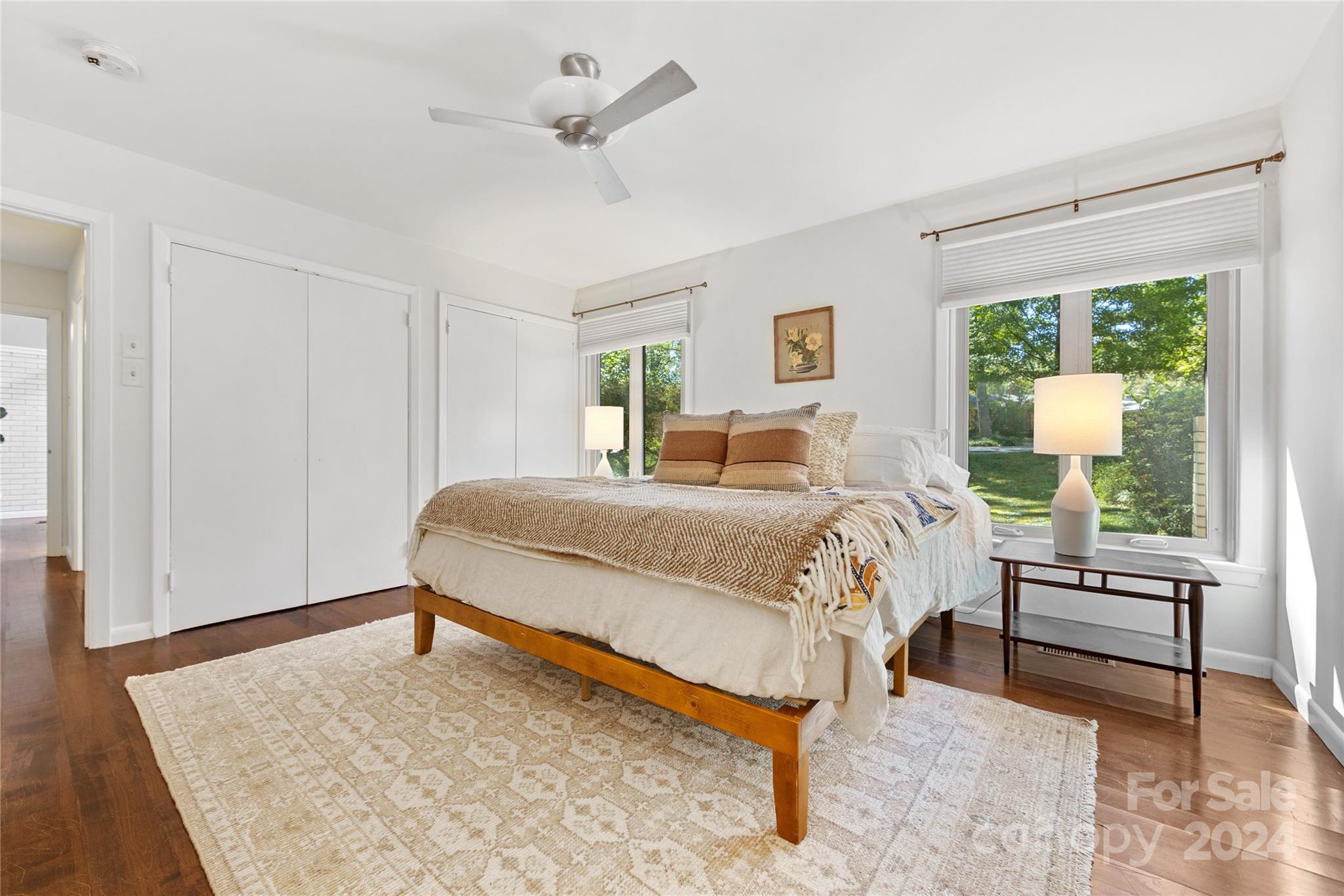 5601 Riviere Drive Charlotte, NC 28211 - Photo 19 of 38 a bedroom with a bed lamp on table and a window