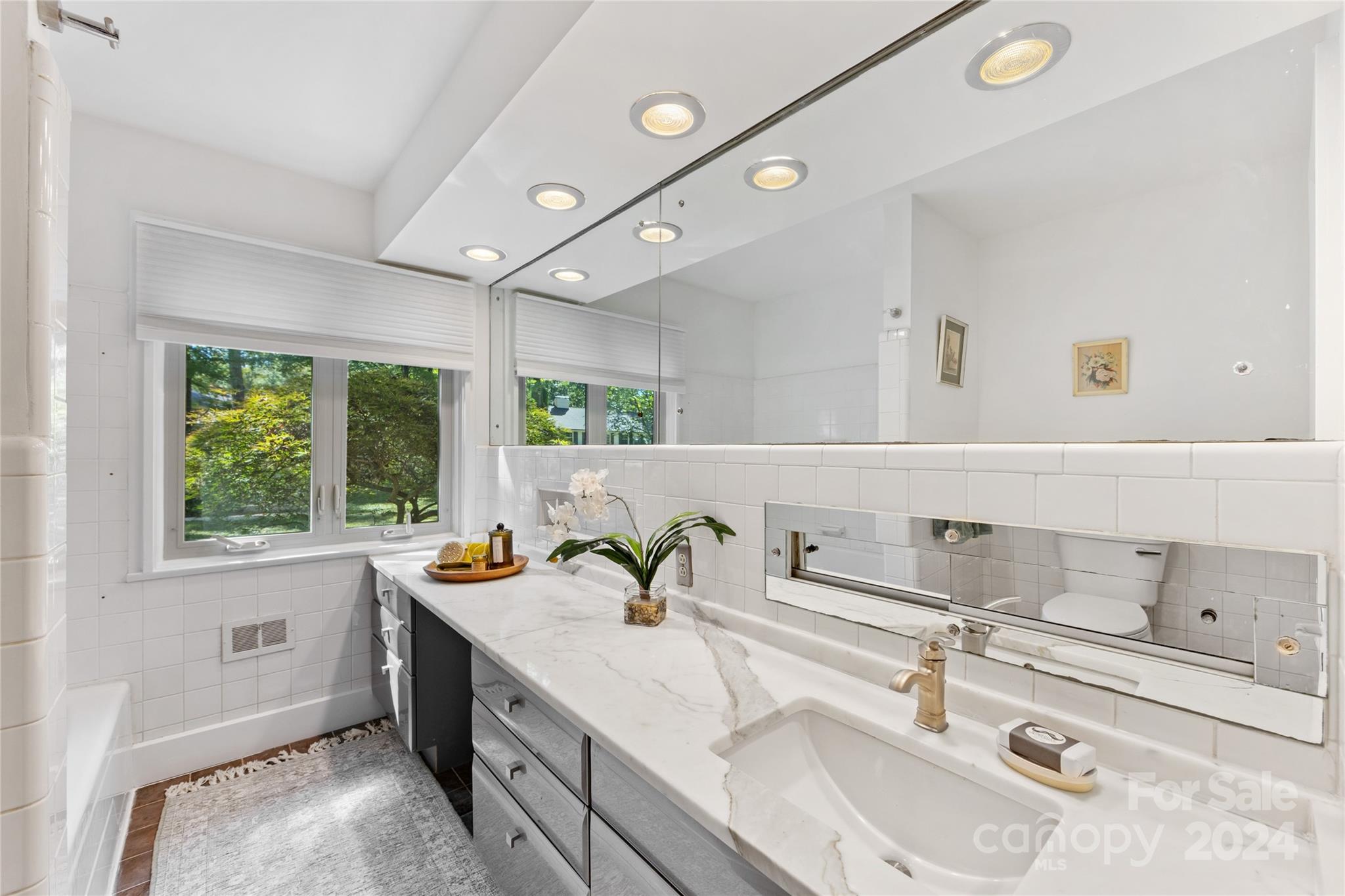 5601 Riviere Drive Charlotte, NC 28211 - Photo 21 of 38 a kitchen with a sink and a stove top oven