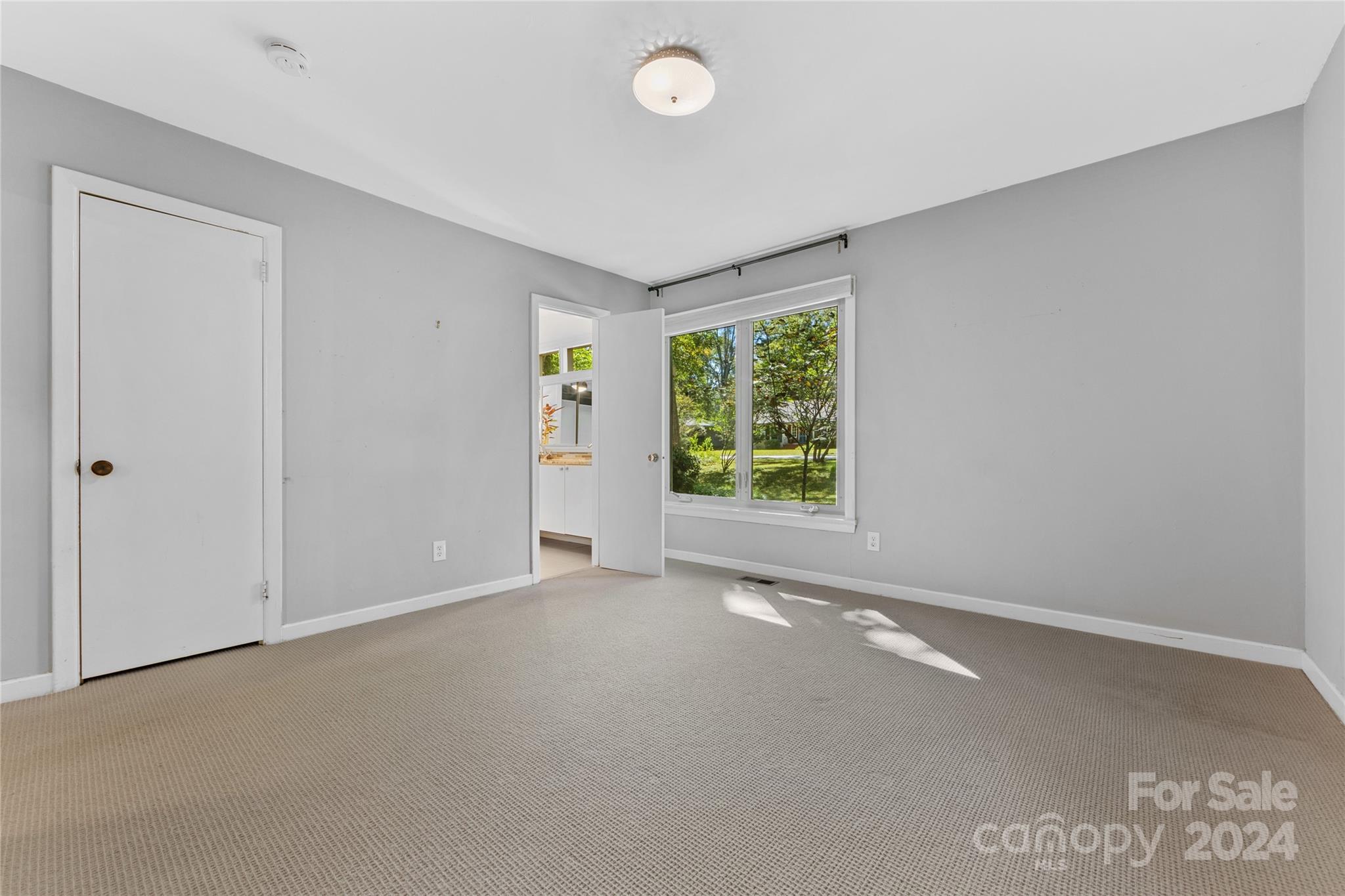 5601 Riviere Drive Charlotte, NC 28211 - Photo 22 of 38 an empty room with windows and closet