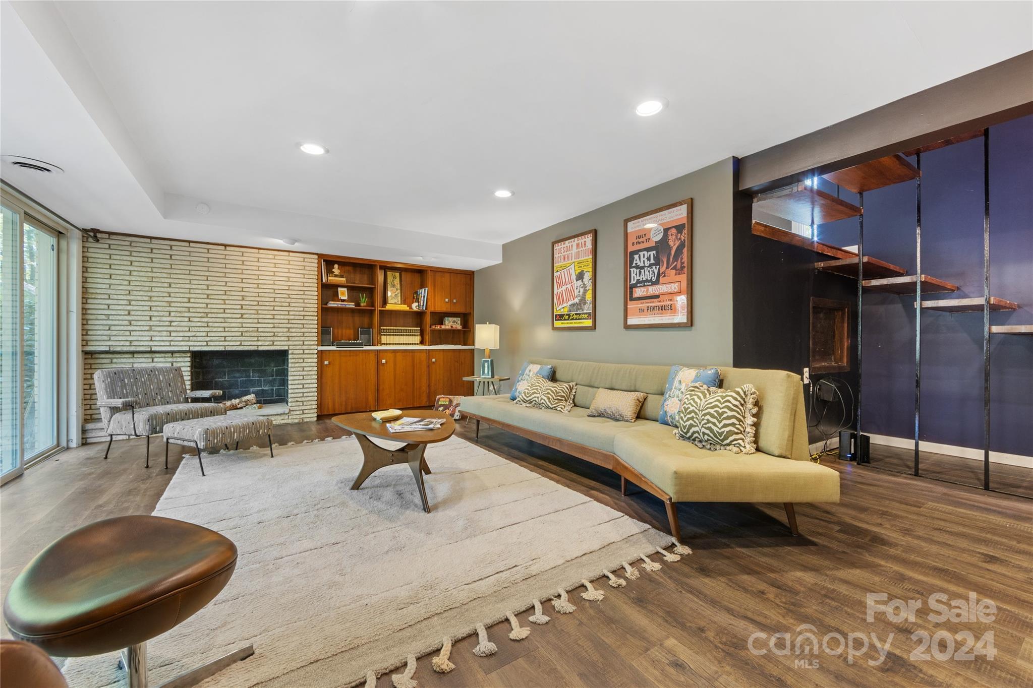 5601 Riviere Drive Charlotte, NC 28211 - Photo 31 of 38 a living room with furniture and a fireplace