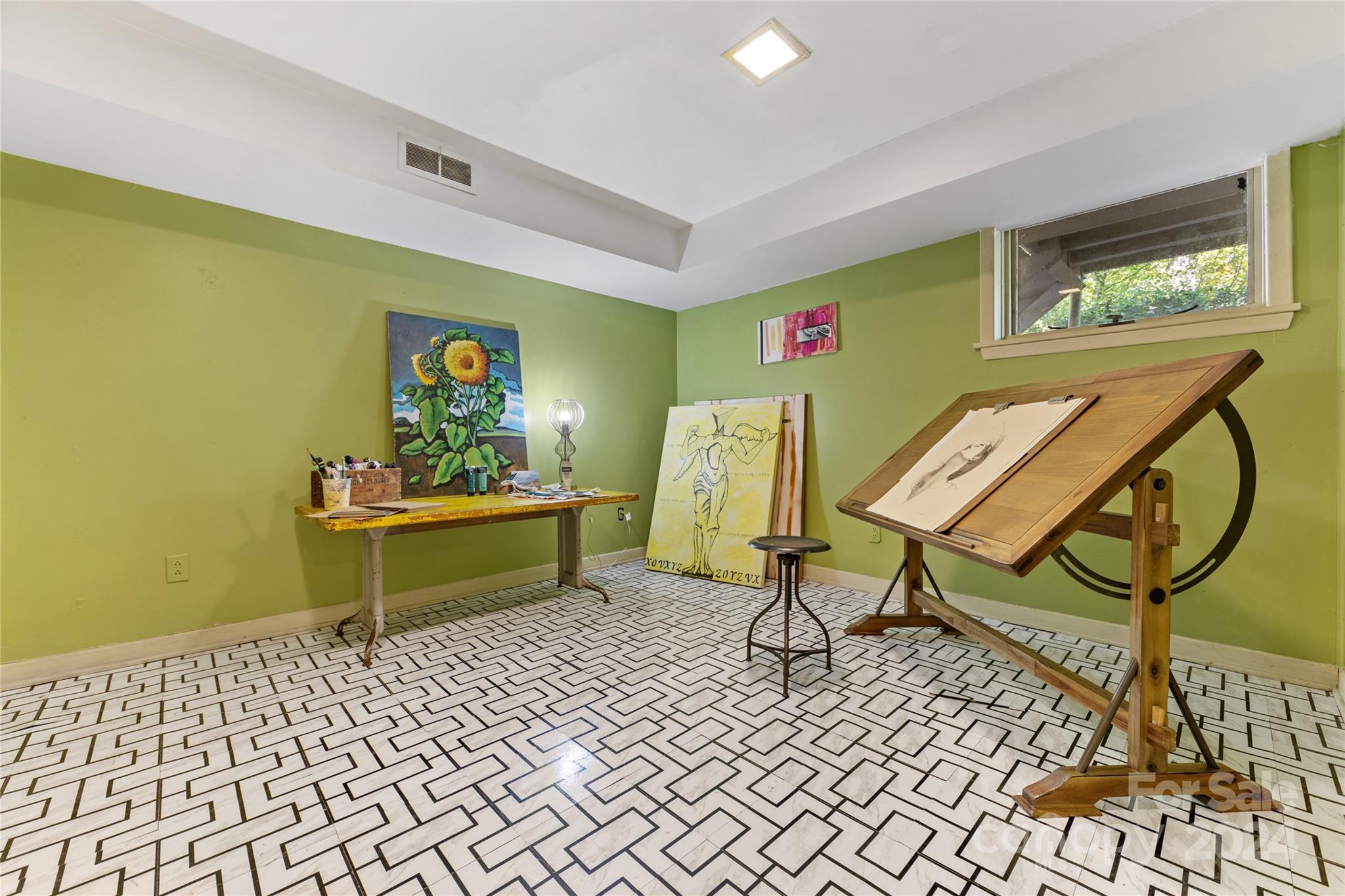 5601 Riviere Drive Charlotte, NC 28211 - Photo 32 of 38 a living room with furniture and a potted plant