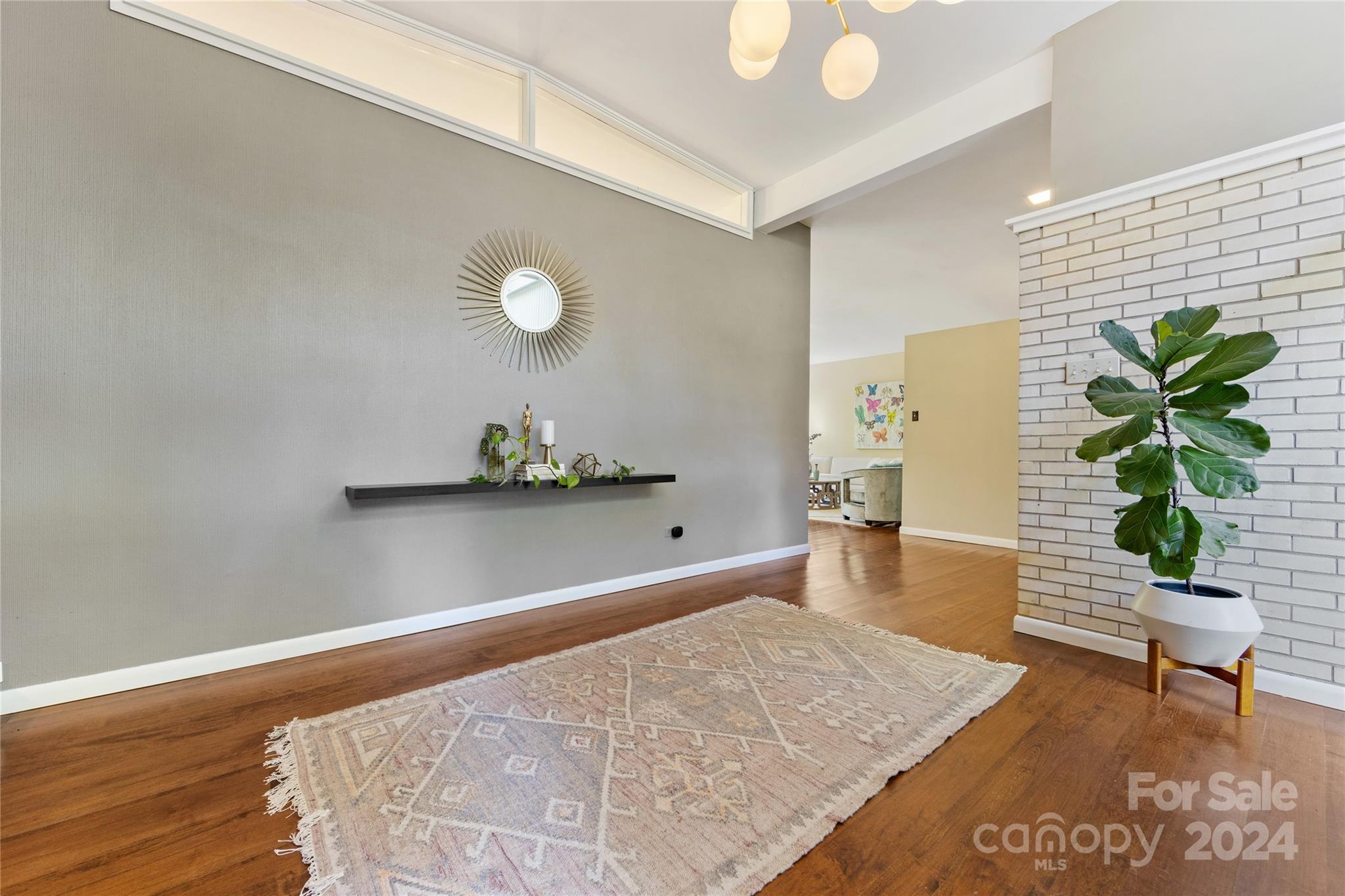 5601 Riviere Drive Charlotte, NC 28211 - Photo 6 of 38 a living room with furniture and a potted plant