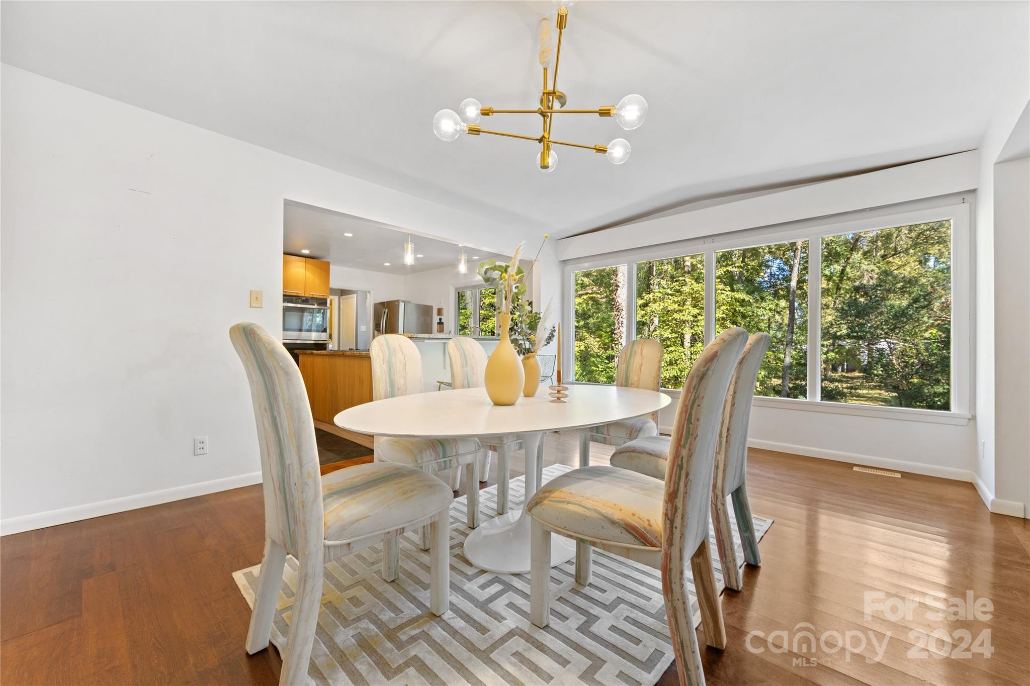 5601 Riviere Drive Charlotte, NC 28211 - Photo 9 of 38 a view of a dining room with furniture window and wooden floor