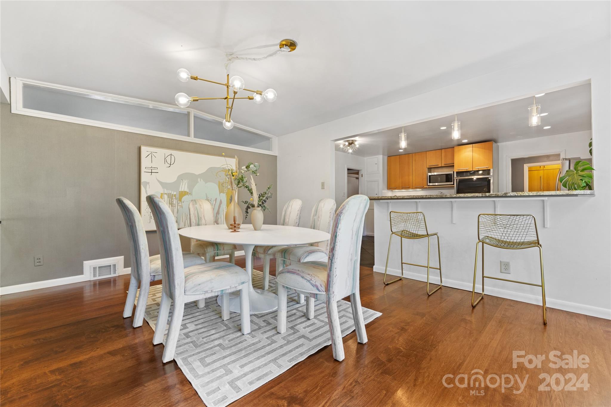 5601 Riviere Drive Charlotte, NC 28211 - Photo 10 of 38 a view of a dining room with furniture and wooden floor