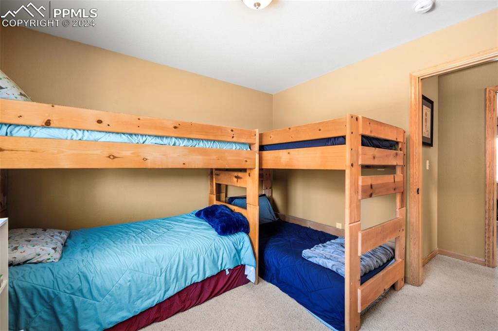 3156 High Creek Road Fairplay, CO 80440 - Photo 16 of 21 a bedroom with a bed and a ceiling fan