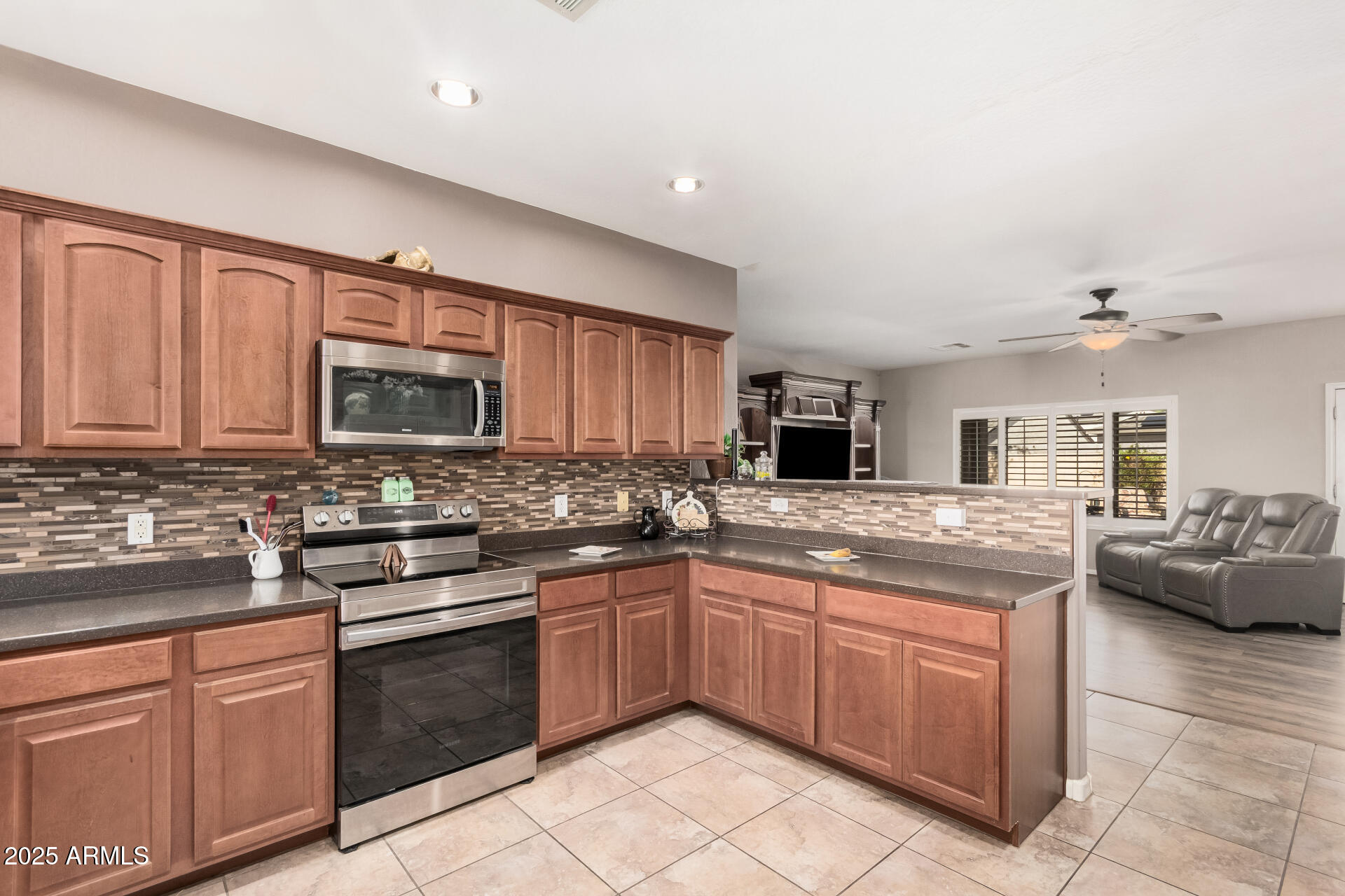 108 East Ridgeview Trail Casa Grande, AZ 85122 - Photo 11 of 34 a kitchen with stainless steel appliances granite countertop a sink stove and cabinets