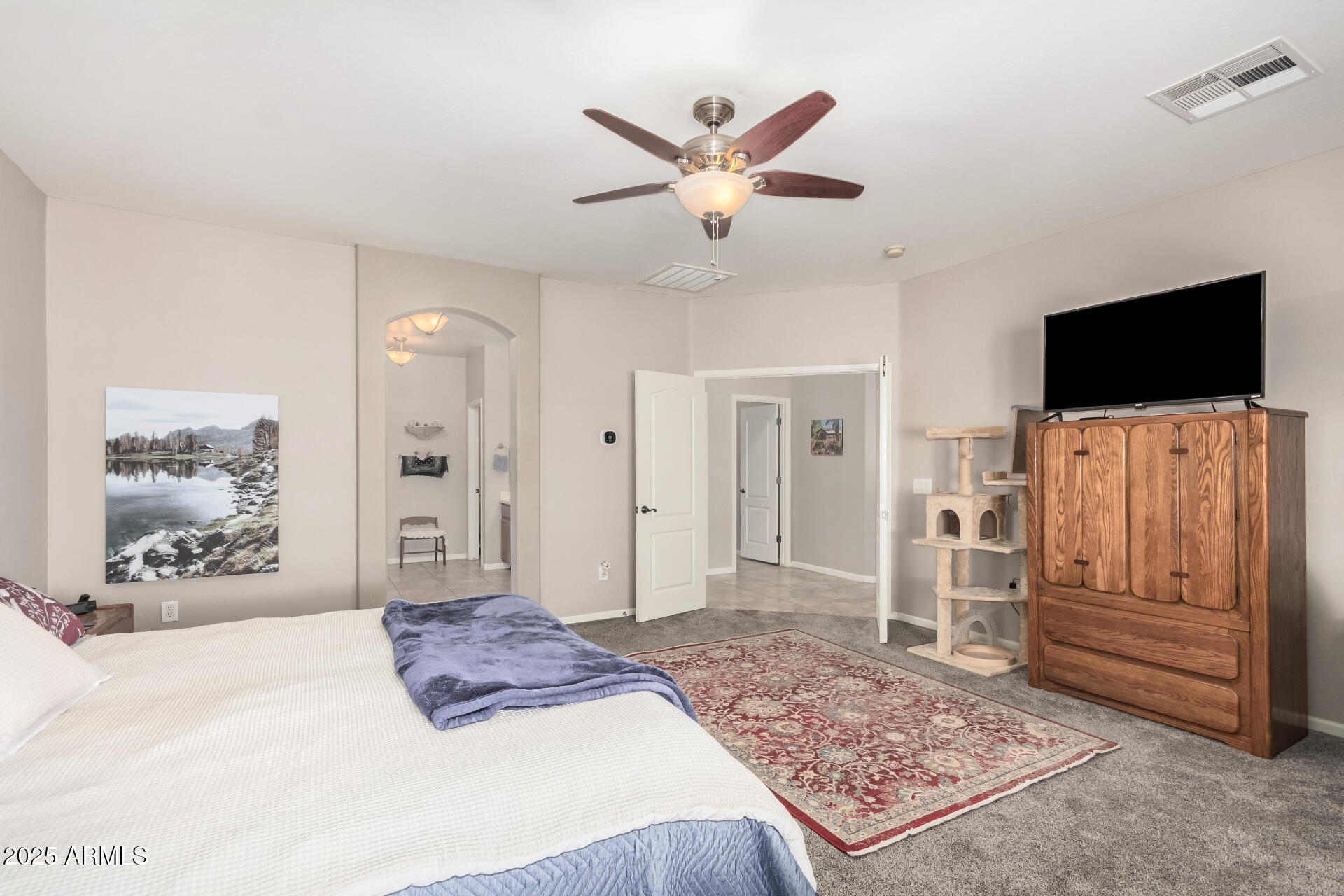 108 East Ridgeview Trail Casa Grande, AZ 85122 - Photo 13 of 34 a bedroom with a bed and a flat screen tv