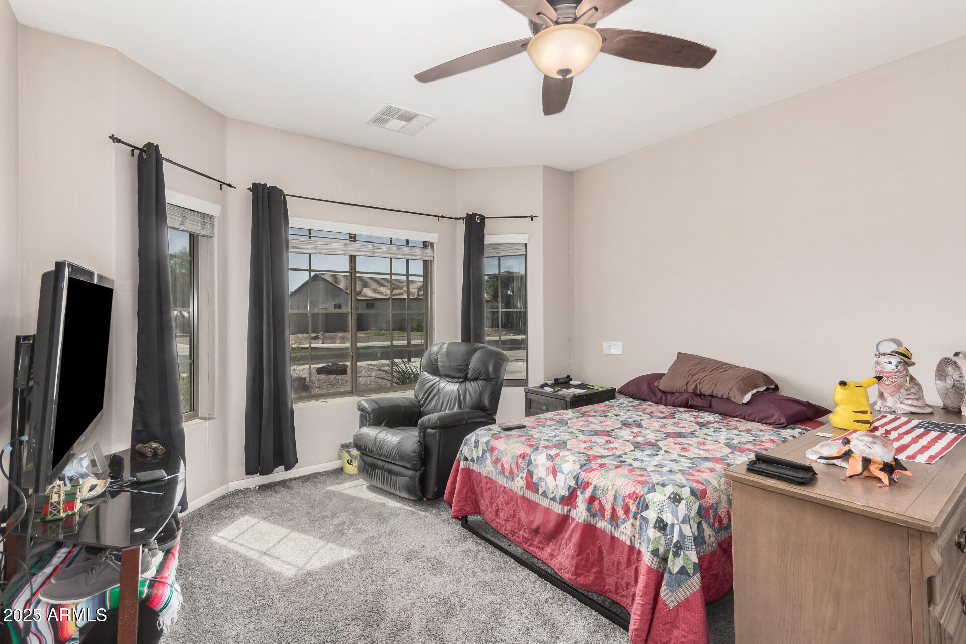 108 East Ridgeview Trail Casa Grande, AZ 85122 - Photo 19 of 34 a bedroom with a bed furniture and a flat screen tv