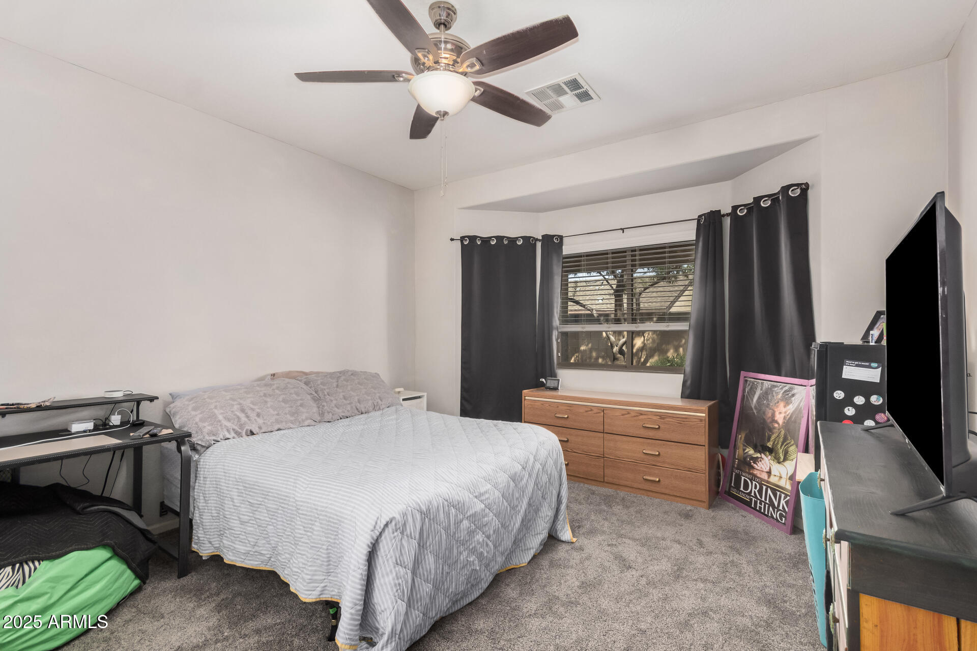 108 East Ridgeview Trail Casa Grande, AZ 85122 - Photo 21 of 34 a bedroom with a bed and a flat tv screen on a dresser