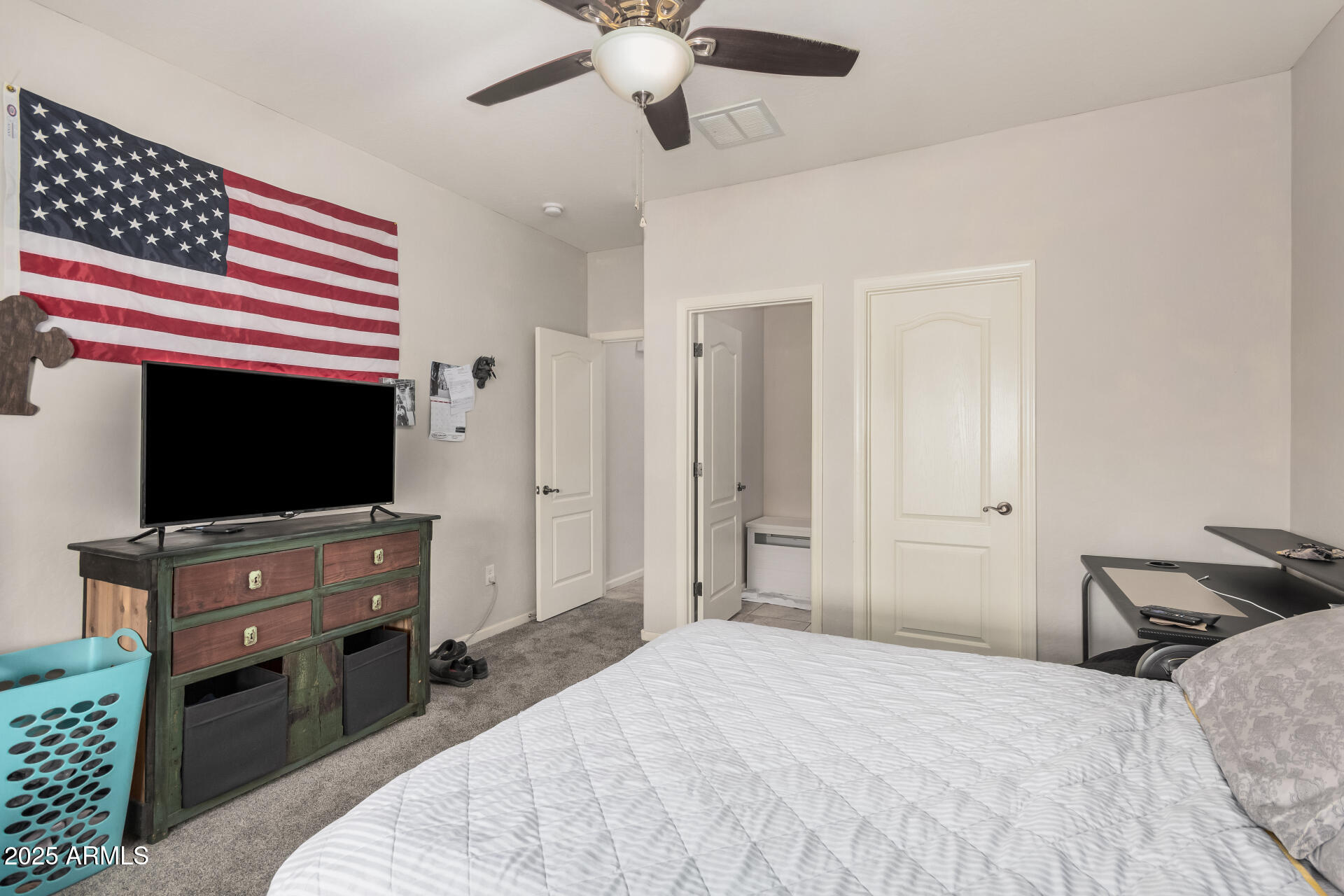 108 East Ridgeview Trail Casa Grande, AZ 85122 - Photo 22 of 34 a bedroom with a bed and a flat screen tv