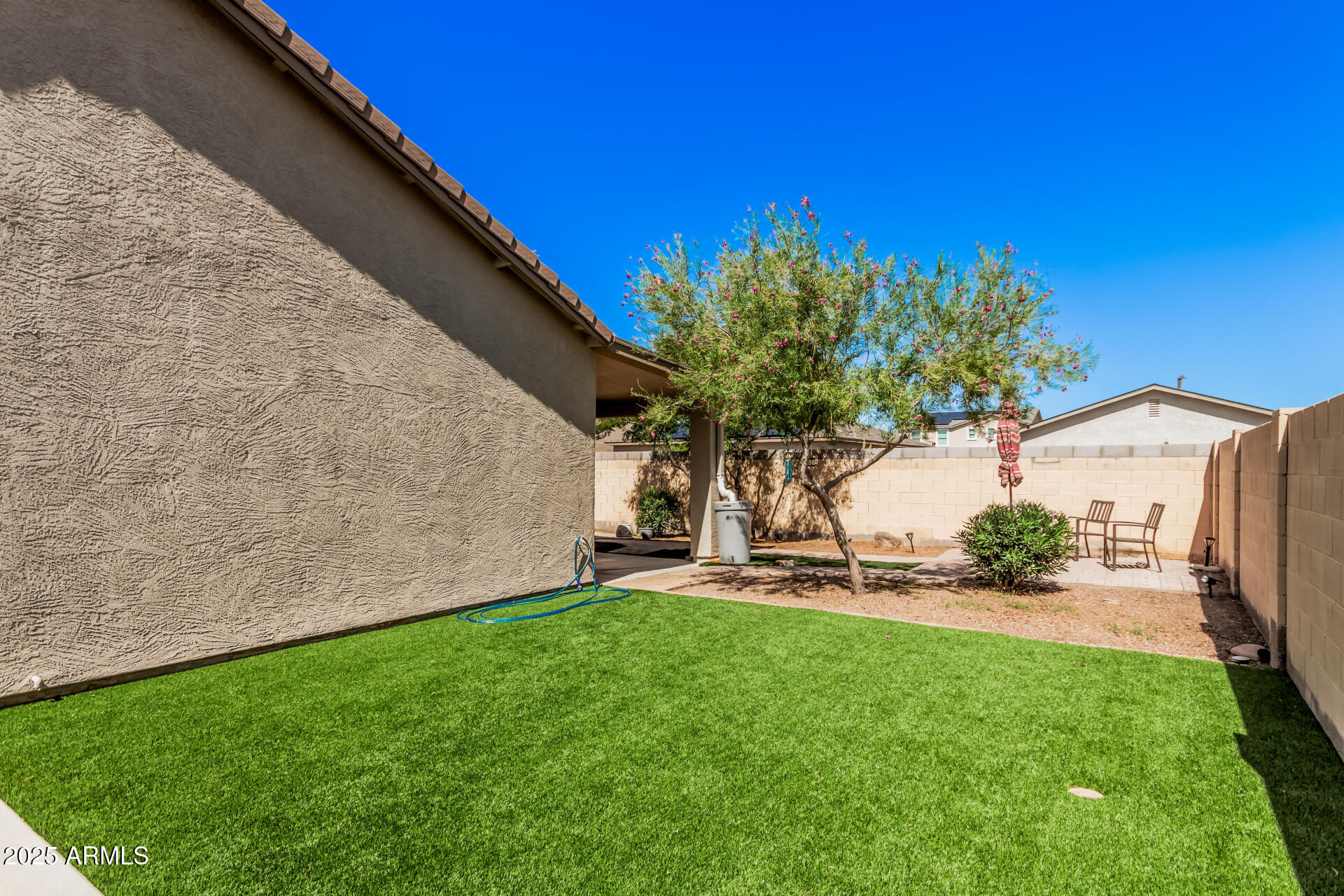 108 East Ridgeview Trail Casa Grande, AZ 85122 - Photo 30 of 34 a backyard of a house with table and chairs