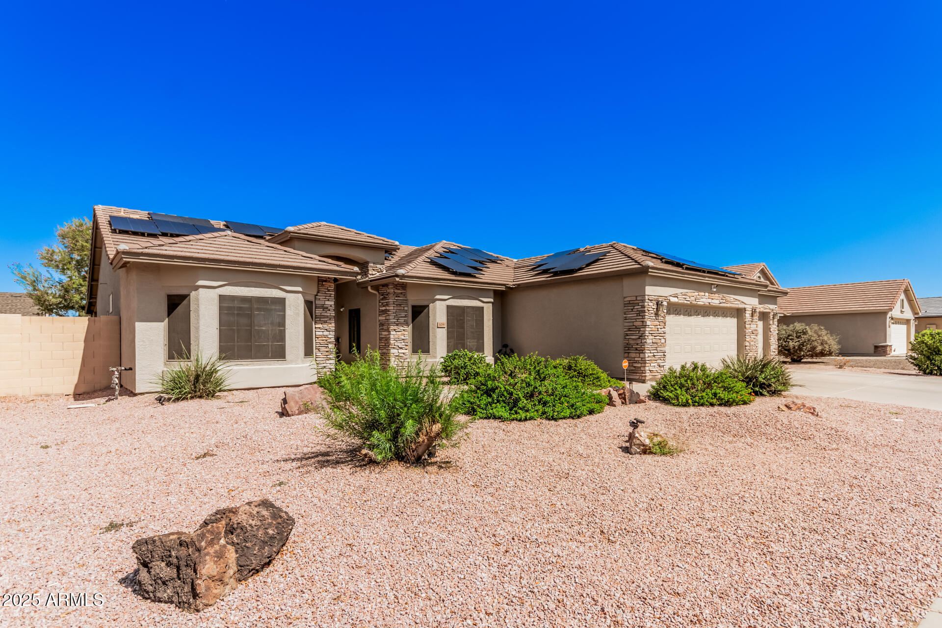 108 East Ridgeview Trail Casa Grande, AZ 85122 - Photo 3 of 34 a front view of a house with a yard and garage