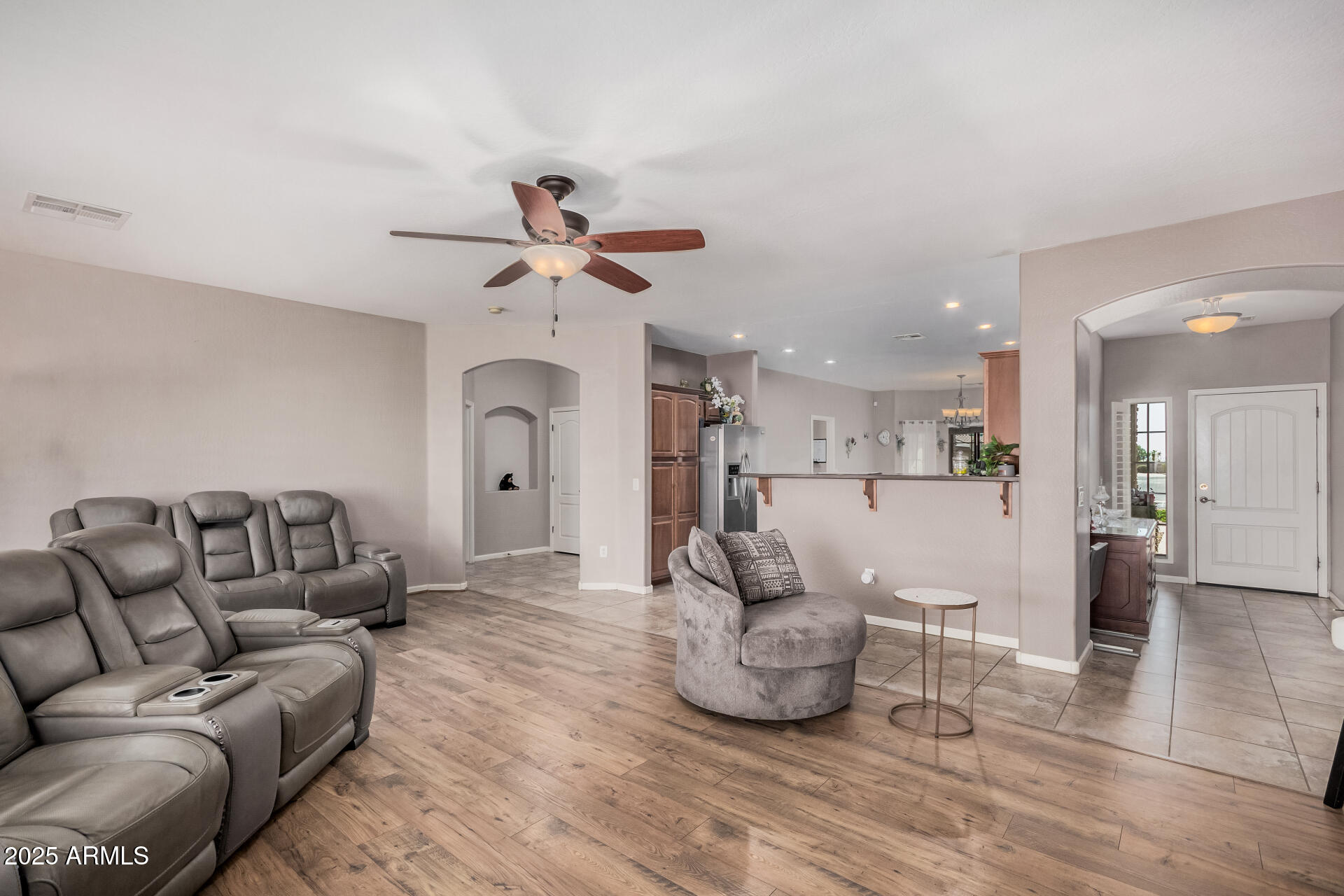 108 East Ridgeview Trail Casa Grande, AZ 85122 - Photo 6 of 34 a living room with furniture and a chandelier