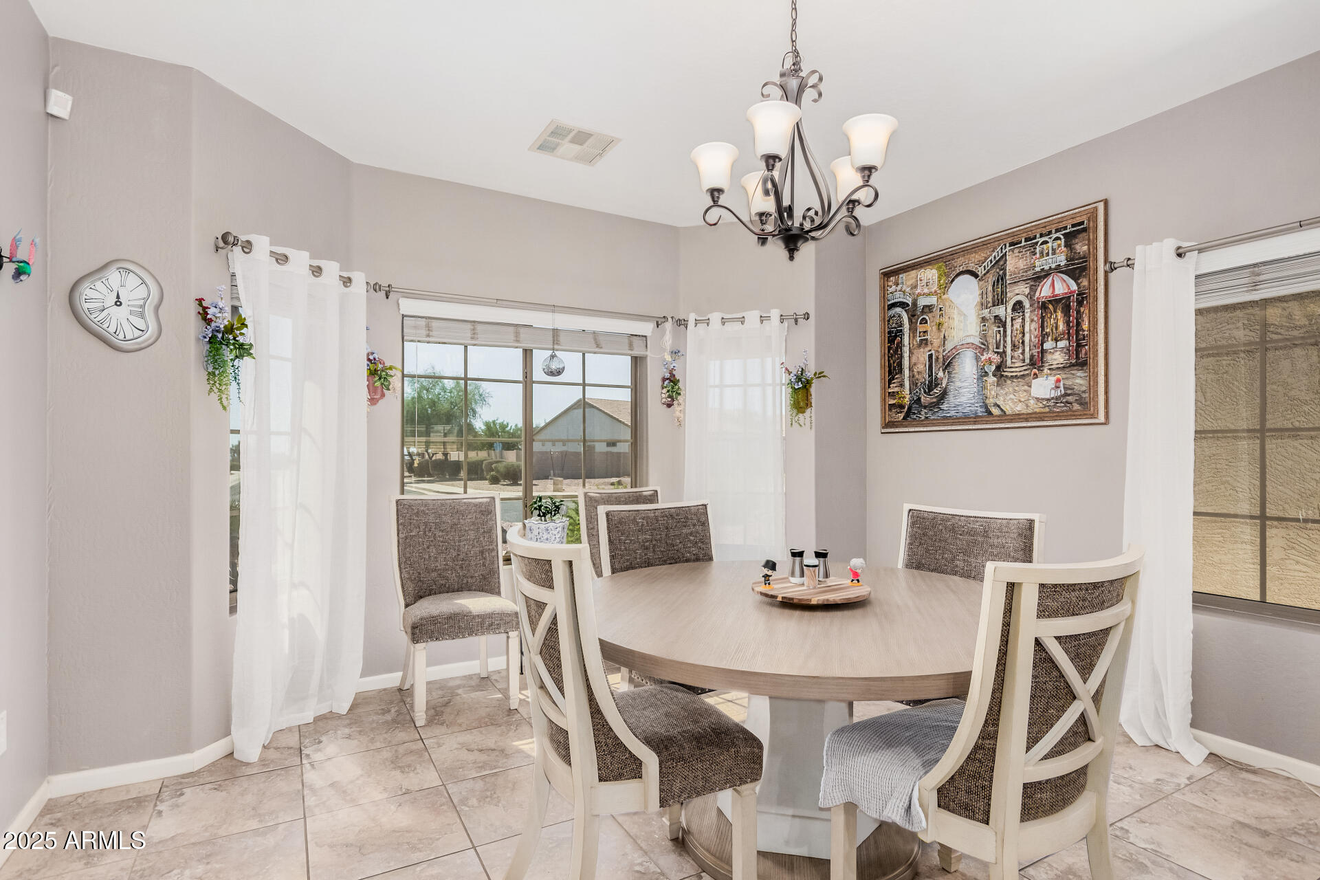 108 East Ridgeview Trail Casa Grande, AZ 85122 - Photo 8 of 34 a dining room with furniture a chandelier and window