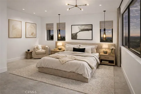 a bedroom with double bed and three large window