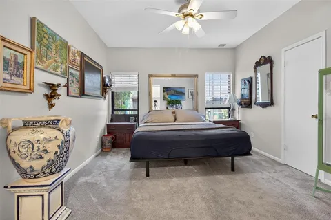 a bedroom with a bed and dresser
