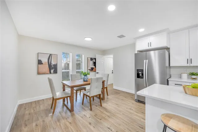 a bed room with a bed mirror and a table