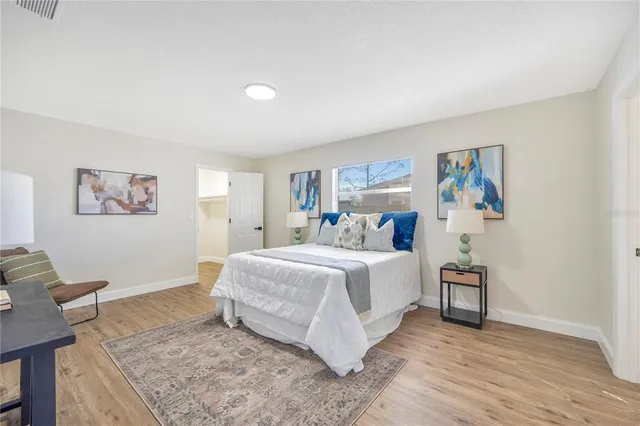 a spacious bathroom with a toilet a sink and a bathtub