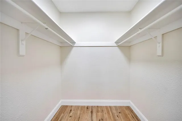 a bathroom with a toilet a sink and a mirror