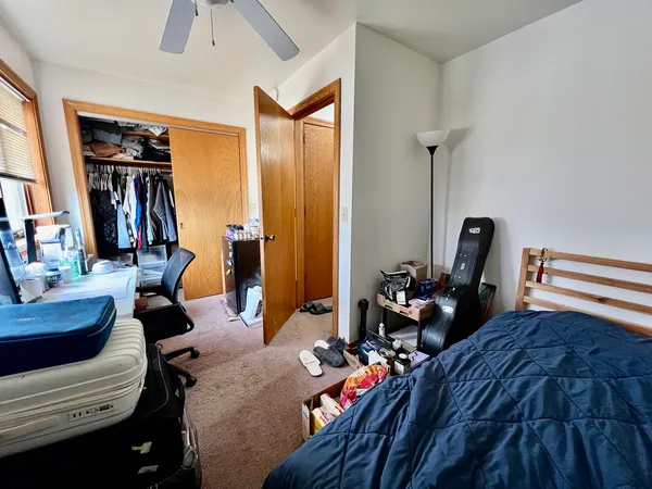 a bed room with furniture and wooden floor