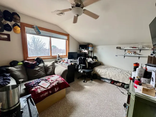 a bed room with furniture and a window