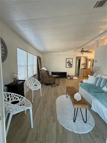 a living room with furniture and a table