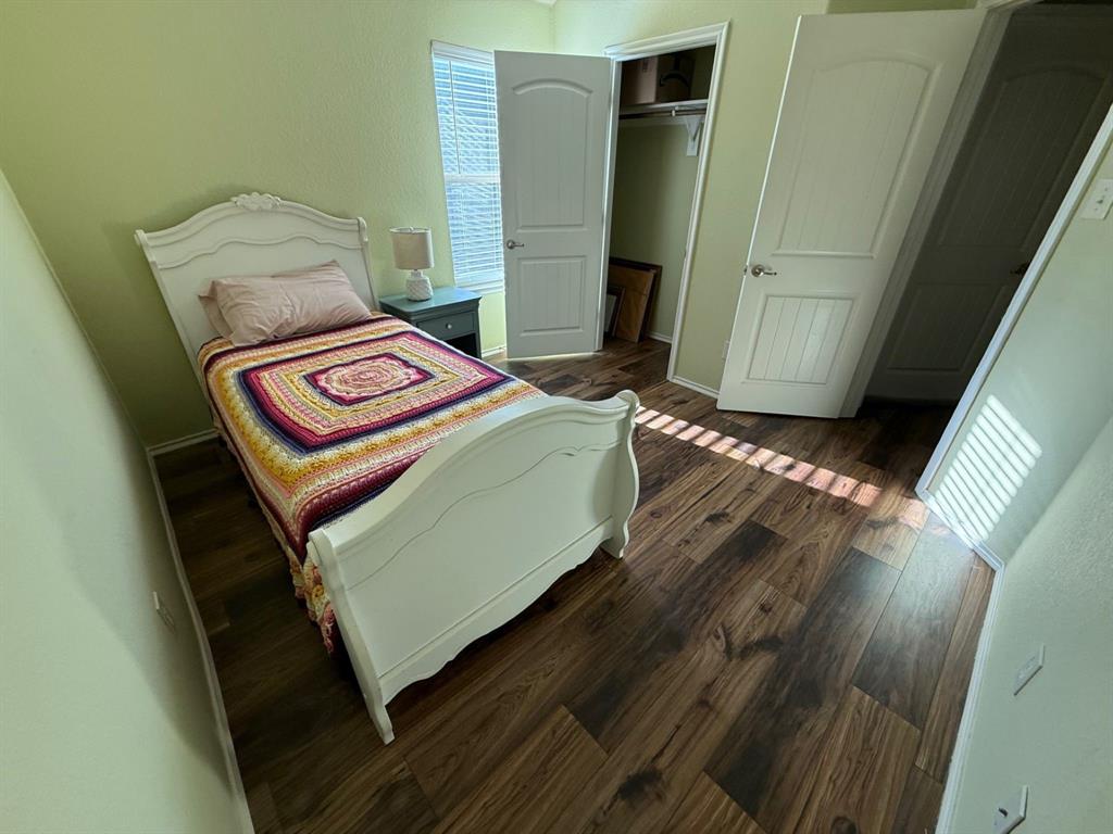 120 Chalk Road Anna, TX 75409 - Photo 23 of 29 a living room with a couch and wooden floor