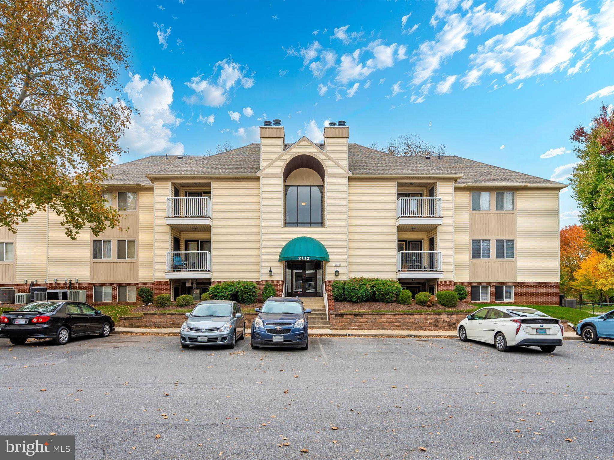 a view of a cars parked in front of a house