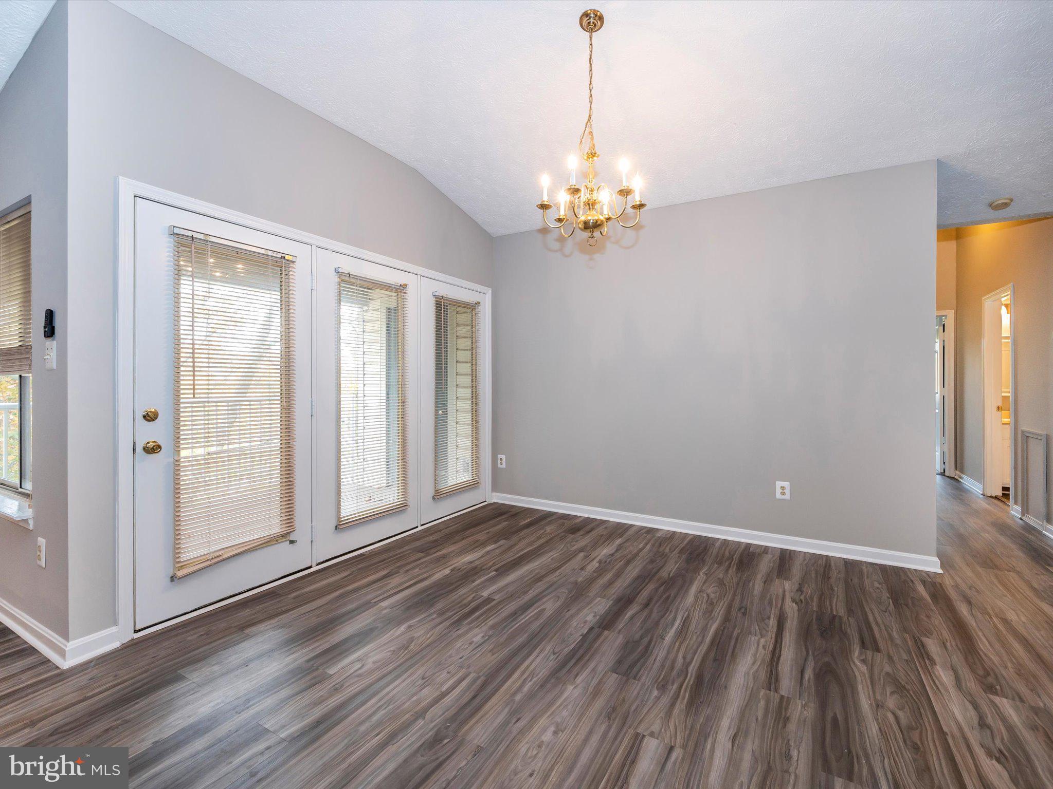 2112 Whitehall Road, Unit 2C Frederick, MD 21702 - Photo 13 of 59 a view of empty room with wooden floor and fan
