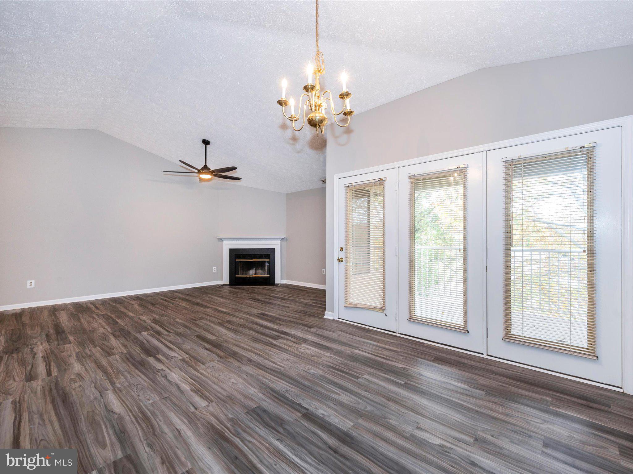 2112 Whitehall Road, Unit 2C Frederick, MD 21702 - Photo 17 of 59 a view of an empty room with a window and wooden floor