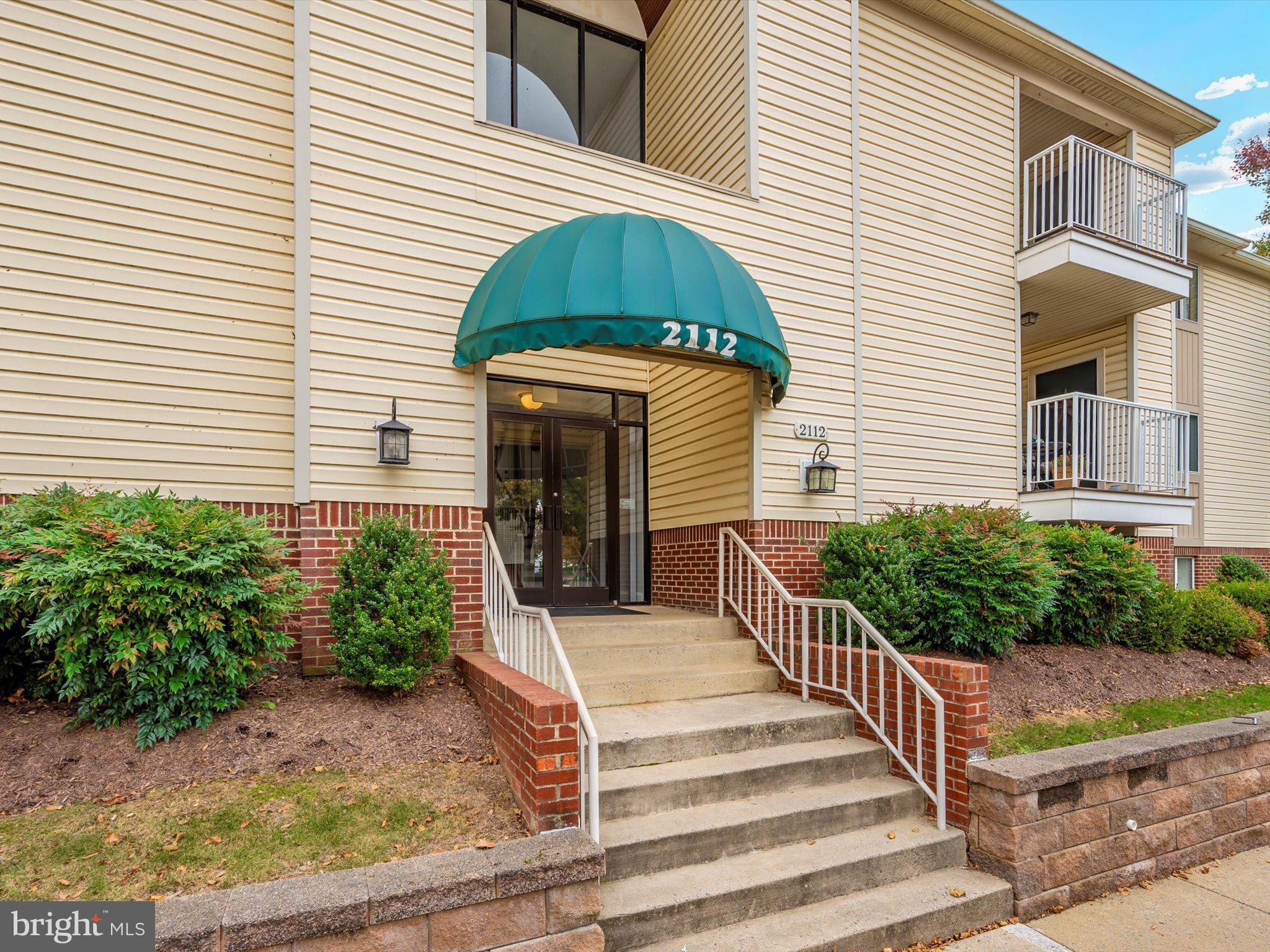 2112 Whitehall Road, Unit 2C Frederick, MD 21702 - Photo 48 of 59 a front view of a house with a yard