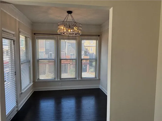 a view of balcony with wooden floor and fence