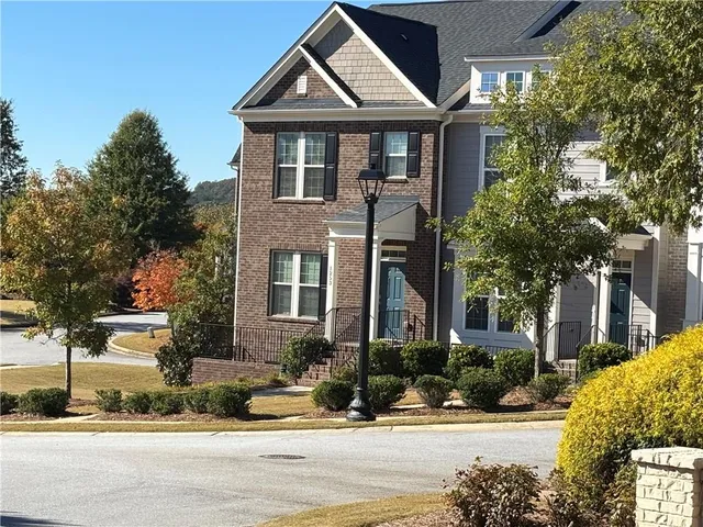 a kitchen with kitchen island a sink appliances and cabinets