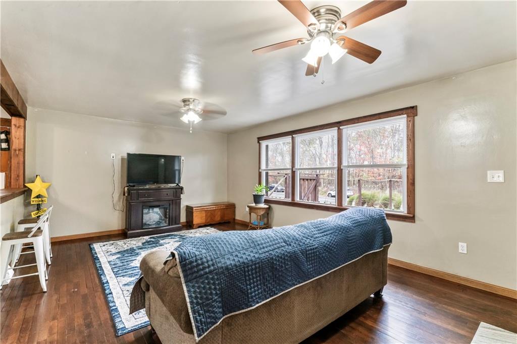 299 Ridge Road Darlington, PA 16115 - Photo 14 of 31 a bedroom with a large bed and a chandelier