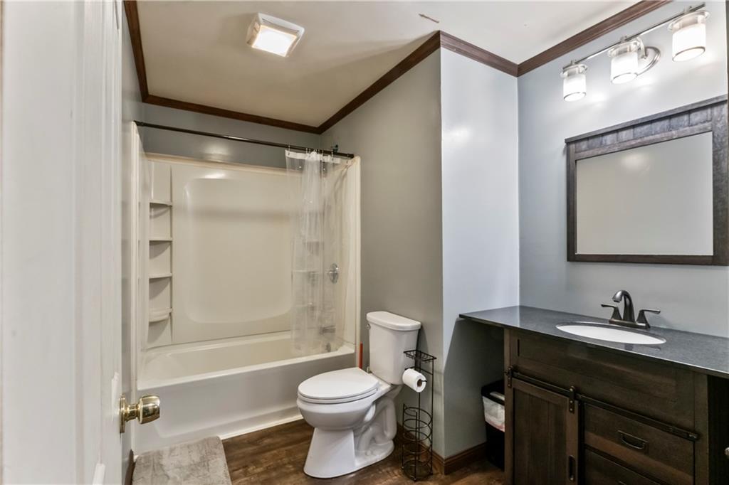 299 Ridge Road Darlington, PA 16115 - Photo 28 of 31 a bathroom with a bathtub shower sink vanity mirror and toilet